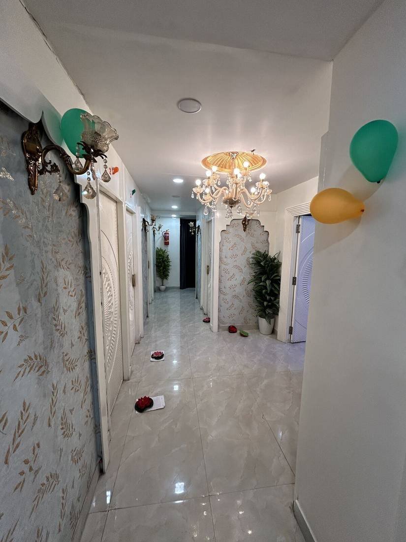 Hallway with chandelier at Wings Spa