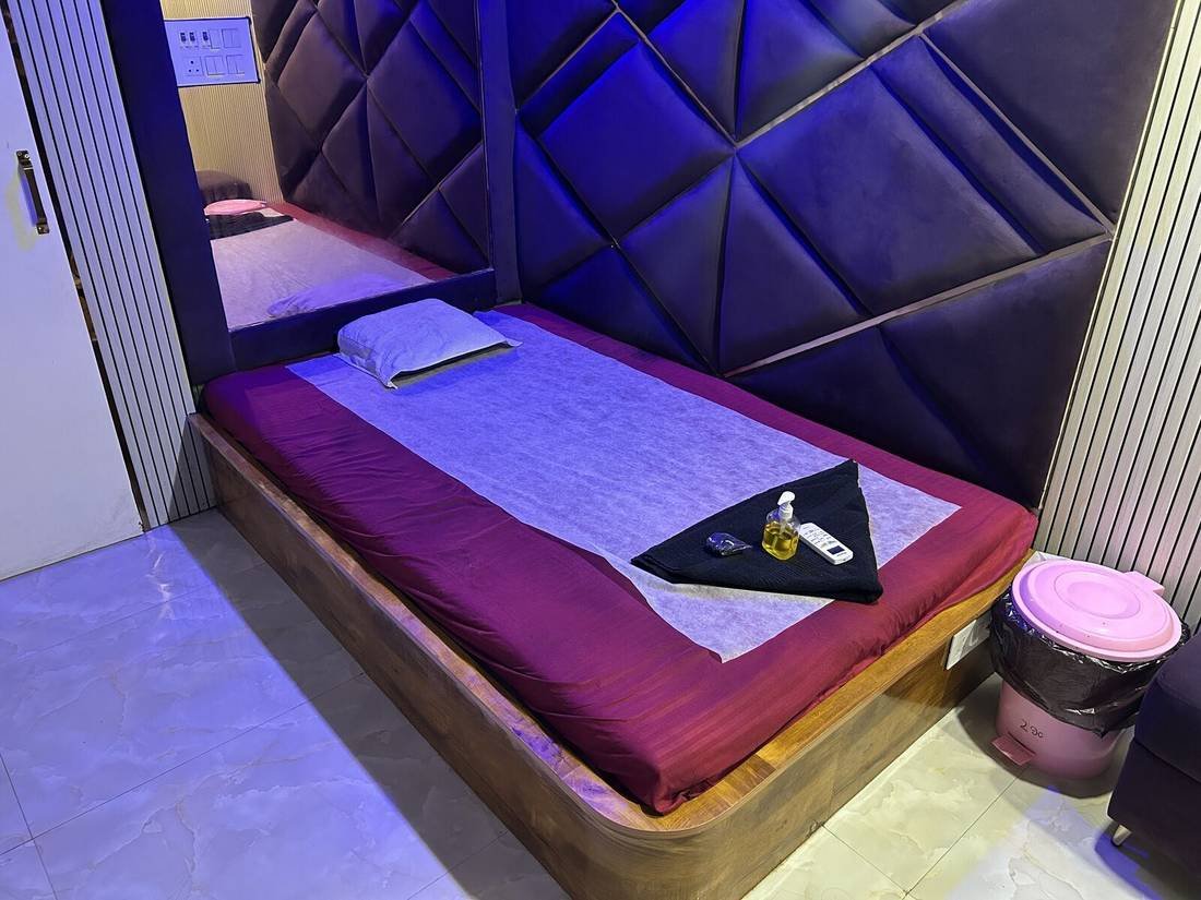 Treatment room seating and decor at Wings Spa