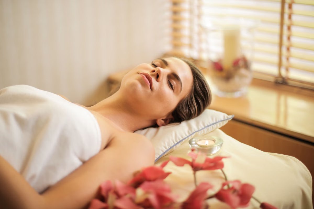 Guest relaxing during a massage session at Wings Spa